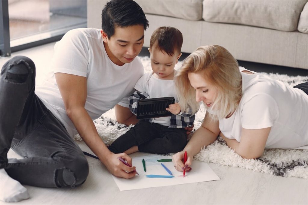 A couple colouring with their child who they set up a property trust for, where ABSD is not payable