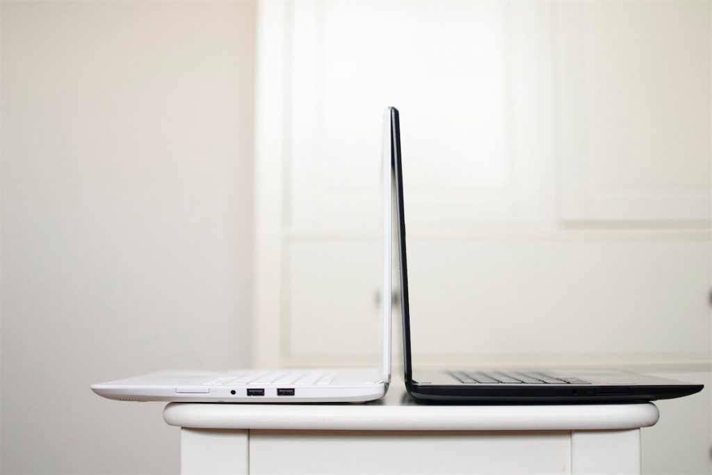 A white and black laptop illustrating the comparison between SIBOR, SORA, and SOR