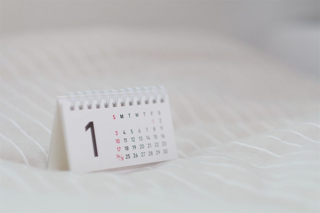 A mini calendar on top of a fabric representing the transition phases of SOR replacing SIBOR