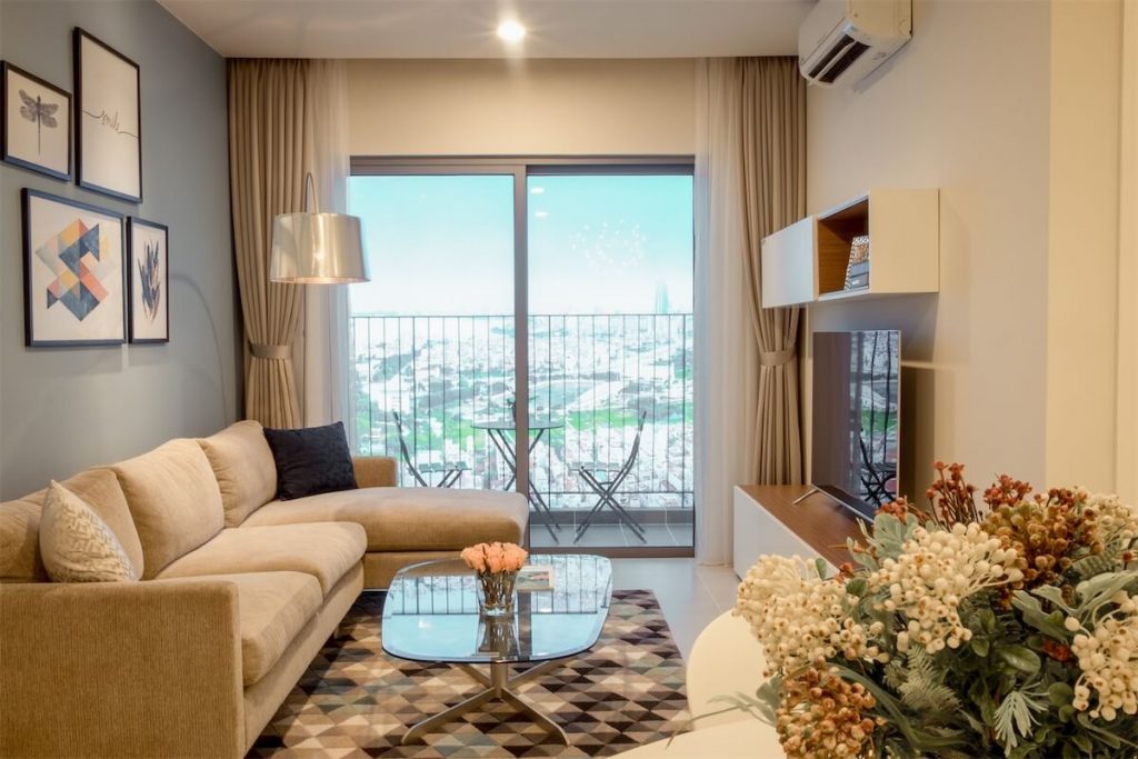 The living room of an upcoming executive condo (EC) in Singapore, featuring a small balcony