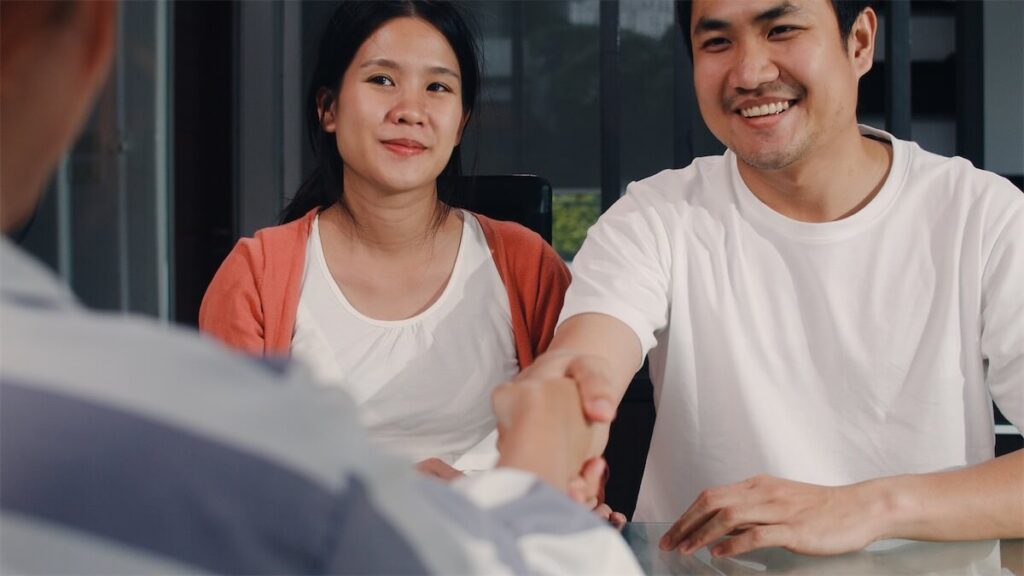 Married couple looking at refinancing their home loan in Singapore